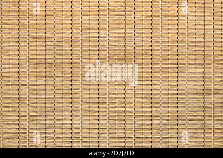 Rattan. Gewebter Mat aus Rohrstock oder Strohgelb. Trockenes Rohrgewebe. Hellgelb. Stockfoto