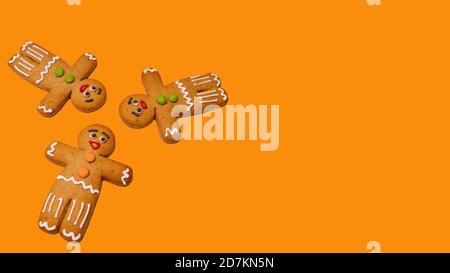 Nahaufnahme von Lebkuchenmännern auf isoliertem orangefarbenem Hintergrund. Festliche Deko Lebkuchen für weihnachtliche Stimmung mit Konzept des klassischen Keks auf Stockfoto