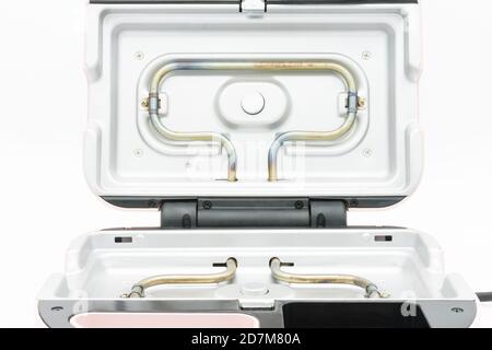 Die Heizelemente auf dem Waffeleisen isoliert auf dem weißen Hintergrund. Stockfoto