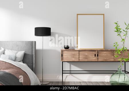 Rahmenmodell im Innenraum. Gemütliches Schlafzimmer mit leerem Posterrahmen. Stockfoto
