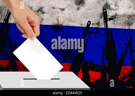 Hand fällt die Wahl vor dem Hintergrund der Flagge, Konzept der Staatswahlen, Referendum Stockfoto