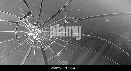 Сracked Glas Nahaufnahme auf grauem Hintergrund. Textur von zerbrochenem Glas Stockfoto