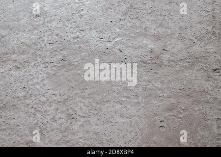 Nahaufnahme einer beigen Oberfläche aus Beton, Gips, Zement. Stockfoto