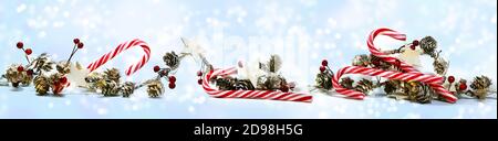 Panorama-Weihnachtsbanner mit Zuckerstöcken, Zapfen, Holzsternen und künstlichen roten Beeren auf schneebedecktem hellblauem Hintergrund mit Kopierraum, Sel Stockfoto