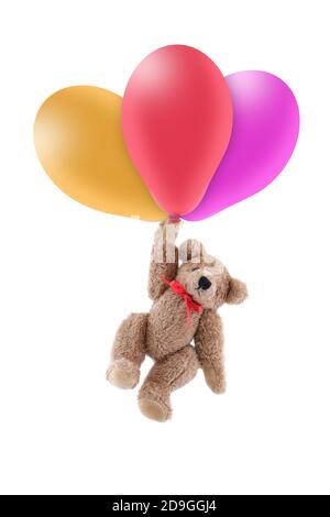 Teddybär wird von farbigen Luftballons mitgenommen Stockfoto