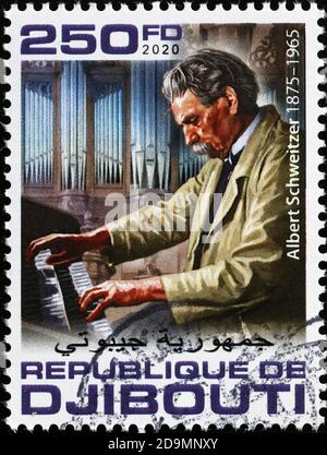 Albert Schweitzer spielt die Orgel auf Briefmarke Stockfoto