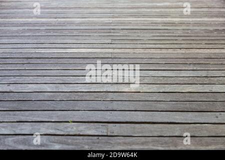 Holzboden, der alt und verwittert als Hintergrund ist Stockfoto
