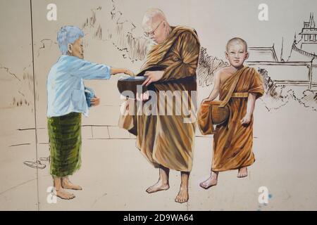 Ein Wandgemälde in der Ong Ang Walking Street von Klong Ong Ang, Chinatown / Phahurat, Bangkok, Thailand, zeigt Mönche während ihrer morgendlichen Almosen-Runde Stockfoto