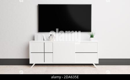 Architektur und Interieur. Modernes Wohnzimmer mit Fernseher und weißem Hintergrund. Minimalistisches Stilkonzept. Innenarchitektur mit TV und Schrank. Stockfoto