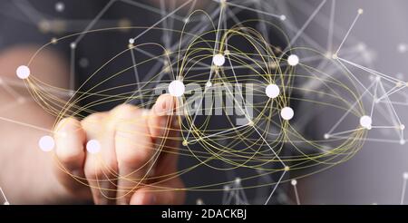 Mann zeigt seinen Finger auf abstrakte Verbindungslinien - Vernetzung Konzept Stockfoto