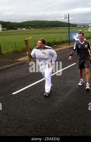 Maidens, Ayrshire, Schottland, Großbritannien. Die London 2012 Olympic Fackel reist durch South Ayrshire, angefeuert von lokalen Gemeinden und Schulkindern Stockfoto