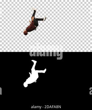 Männlicher Koch kocht in roter Uniform und macht Saltos und Hand Drehungen l Stockfoto