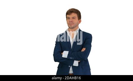 Hübscher junger Geschäftsmann, Arme gekreuzt stehend, lächelnd anständig Stockfoto