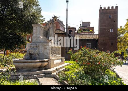 Piazza Giuseppe Gioacchino Belli, die Gedenkstatue und im Hintergrund der Turm von Anguillara. Rom, Latium, Italien, Europa Stockfoto