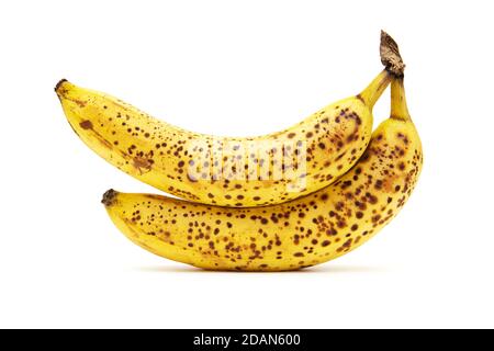 Zwei reife gelbe Bananen mit Flecken isoliert auf einem weißen Hintergrund Stockfoto