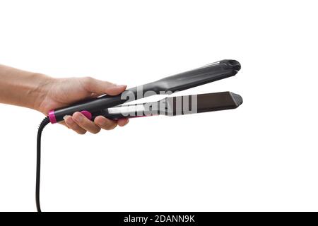 Hand hält elektrische Lockenstab isoliert auf weißem Hintergrund. Mit Clipping-Pfad. Stockfoto