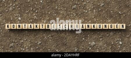 Holzwürfel mit deutscher Botschaft für KONTAKTBEGRENZUNGEN auf Schmutz Schotterhintergrund - 3d-Illustration Stockfoto