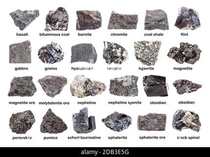 Satz verschiedener dunkler, ungeschliffener Mineralien mit Namen (Chromit, Sphalerit, Magnetit, Hyalobasalt, Nephelinsyenit, Molybdän, Obsidian, Knopit, p Stockfoto