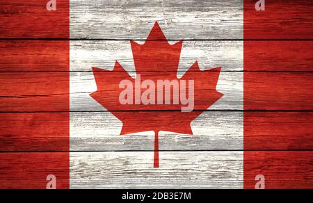 Maple Leaf kanadische Nationalflagge auf altem Holzbrett gemalt Hintergrund Stockfoto