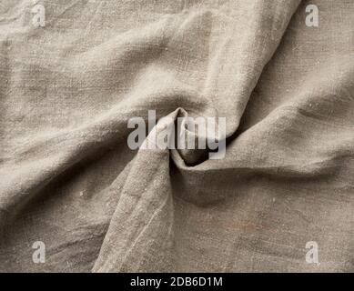 Verdrehte, sehr alte, graue Leinenstoff aus Vintage-Qualität, Vollformat, raue antike Leinwand Stockfoto