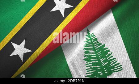 St. Kitts und Nevis und Norfolk Island zwei Flaggen Textiltuch, Stoff Textur Stockfoto