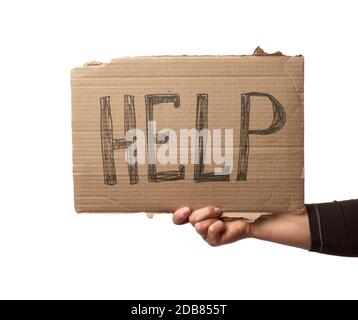 Hand hält ein Stück Pappe mit der Aufschrift Help, Mutual Assistance Concept, Homeless, Financial Crisis Stockfoto