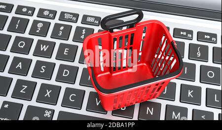 Roter Korb Lebensmittel Einkaufswagen auf einem Laptop-Tastatur. Online-Shopping-Konzept. 3d-Rendering. Niemand da. Stockfoto