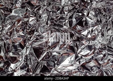 Folienstruktur. Nahaufnahme mit silberner Textur. Makrofoto Stockfoto