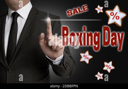 Boxing Day Touchscreen gesteuert Geschäftsmann. Stockfoto