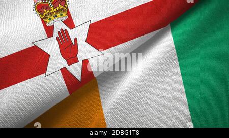 Nordirland und Elfenbeinküste Elfenbeinküste zwei Flaggen Textil Stoffstruktur Stockfoto