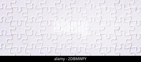 Weiße leere Puzzle Nahaufnahme. Langer Hintergrund und Textur Stockfoto