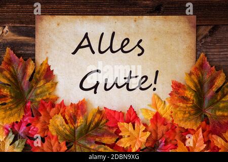 Altes Papier Mit Deutschem Text Alles Gute Bedeutet Beste Wünsche. Farbenfrohe Herbstdekoration Mit Blättern Stockfoto