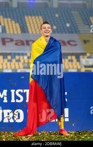 Ploiesti, Rumänien. November 2020. Ionut Costache #20 von Rumänien feiert die Qualifikation für die europäische U-21-Meisterschaft 2021 Qualifying Round Spiel zwischen den Nationalmannschaften von Rumänien und Dänemark im 'Ilie Oana' Stadion in Ploiesti, Rumänien. 17.11.2020. Foto: Copyright 2020, Quelle: Cronos/Alamy Live News Stockfoto