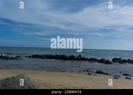Strand von Gran Canaria in Meloneras, Strand in der Nähe des Leuchtturms. Stockfoto