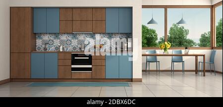 Moderne blaue und hölzerne Küche mit Esstisch und Stuhl Auf dem Hintergrund - 3d-Rendering Stockfoto