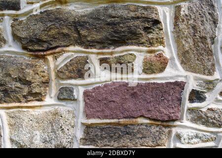 Pennsylvania Bauernhaus roten Steinmauer Hintergrund. Lebendige Farben und Mauerwerk Textur und Farben, solide robust und zuverlässig Stockfoto