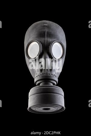 Schwarze Gasmaske auf schwarzem Hintergrund isoliert. Umweltverschmutzung. Stockfoto