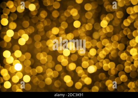 Festlicher goldener Hintergrund, Textur, Girlanden Seiten Lichter Stockfoto