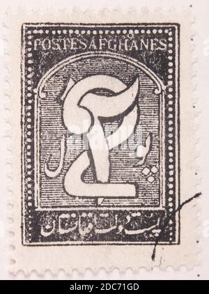 Antwerpen, Belgien - 17. November 2020: Ein Briefmarkendruck der afghanischen Post, zeigt afghanisches Symbol Stockfoto
