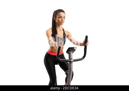 Junge Frau in Sportbekleidung Training auf einem stationären Fahrrad isoliert Auf weißem Hintergrund Stockfoto