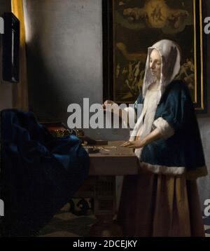 Johannes Vermeer, (Künstler), Holländisch, 1632 - 1675, Woman Holding a Balance, c. 1664, Öl auf Leinwand, bemalte Oberfläche: 39.7 x 35.5 cm (15 5/8 x 14 Zoll), Tragerahmung: 62.9 x 58.4 x 7.6 cm (24 3/4 x 14 15/16 Zoll), gerahmt: 23 x 16 3/4 x 38 cm (42.5 x   x 3 Zoll Stockfoto