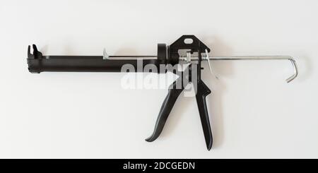Silikondichtpistole isoliert auf weißem Hintergrund Stockfoto
