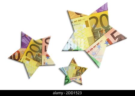 Drei Sterne aus Banknoten vor weißem Hintergrund Stockfoto