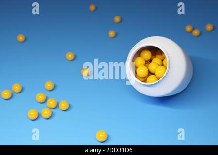 Gelbe runde Vitamintabletten in einem großen weißen Glas und In der Nähe auf blauem Hintergrund verstreut Stockfoto