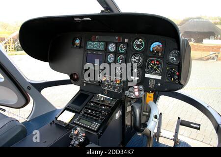 The interior of the cockpit of a helicopter showing the flight controls Stockfoto