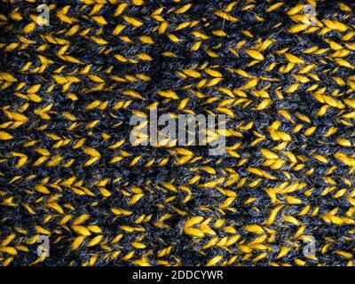 Strickstruktur Hintergrund gelb und schwarz Hintergrund Stockfoto