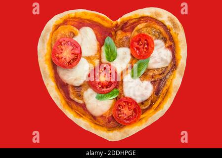 Herzförmige Pizza für einen besonderen Abend Stockfoto