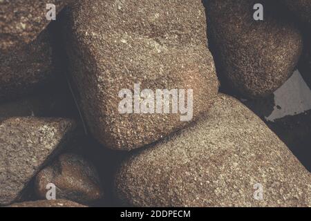 Nahaufnahme von Naturstrandsteinen Stockfoto