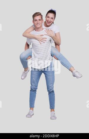 Mädchen Reiten Mann Zurück. Mann Hält Mädchen. Paar Isoliert. Mädchen auf Mann zurück sitzen. Stockfoto