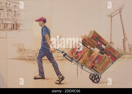 Ein Wandbild in der Ong Ang Walking Street entlang Klong Ong und in der Chinatown / Phahurat Gegend von Bangkok, Thailand, zeigt einen Portier mit seinem Handwagen Stockfoto